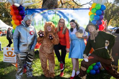 Julie Castle with a group of people dressed up as The Wizard of Oz characters