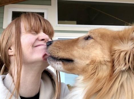 Friday the collie kissing Killeen's chin