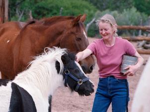 Woman with horses outdoors