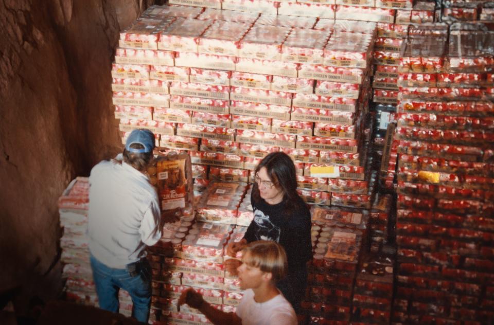 Workers with large palettes of food