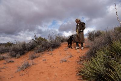 Best Friends co-founder Gabriel de Peyer out for a walk on sand with a dog