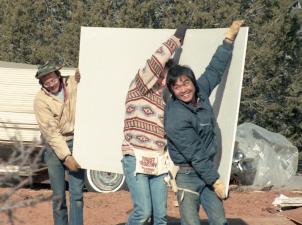 Co-founders Steven Hirano and Antony Gleeson carrying a piece of drywall