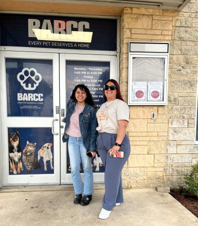 Jazmin and another person by the BARCC building door