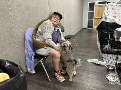 Bonnie Sylvano and her dog Bode at the Ross Norton Emergency Evacuation Center