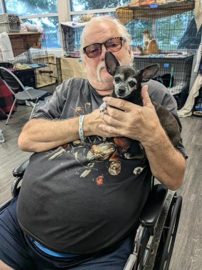 Person at Ross Norton Emergency Evacuation Center with his dog