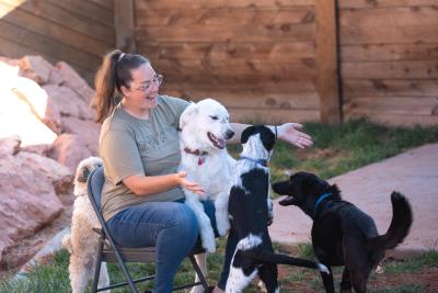 Makayla with foster Greggy and her own dogs