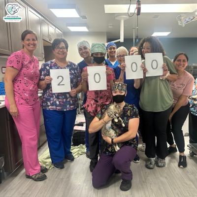 Staff from the Spay Neuter Veterinary Clinic of the Sandhills holding pieces of paper that say 2000