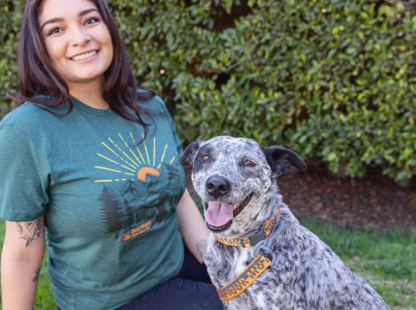 Smiling person next to a smiling dog