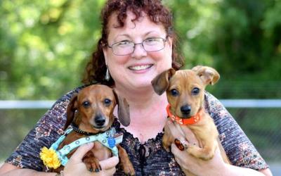 BJ holding Thunder and Peanut the dogs