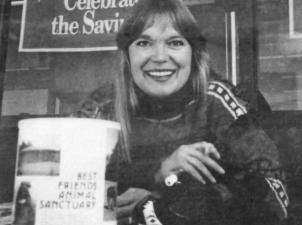 Woman at table collecting donations