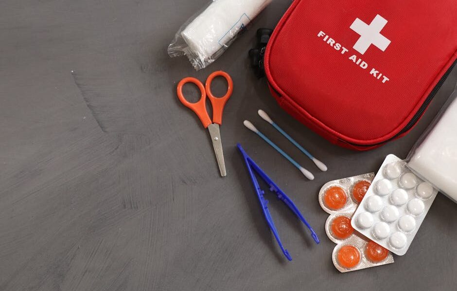 A comprehensive first aid kit with essential medical tools and supplies for emergencies.