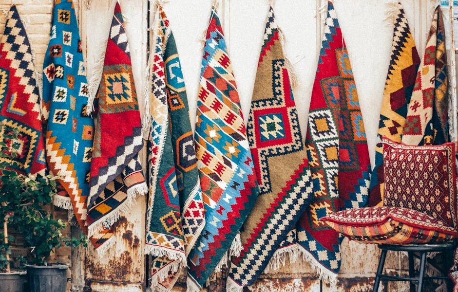 Vibrant Persian rugs hung for display in Shiraz, showcasing traditional Iranian craftsmanship.